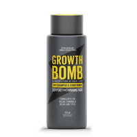 A 300ml bottle of Growth Bomb US 2 in 1 Shampoo & Conditioner for thinning hair comes in a dark gray design with bold yellow and white text, featuring a potent Redensyl-infused antioxidant formula to promote growth and support aging, thinning, and weak hair.
