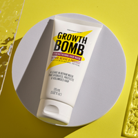 A 175 ML tube of the 10 Minute Miracle Mask rests on a circular white surface against a yellow background, featuring benefits like repair, revive, and protect. It deeply hydrates, protects, volumizes, and strengthens hair.