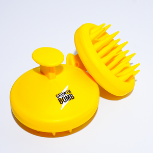 Growth Bombs bright yellow Silicone Scalp Brushes feature round handles and soft, flexible bristles, perfect for exfoliating and enhancing hair and scalp care, beautifully displayed on a white background.
