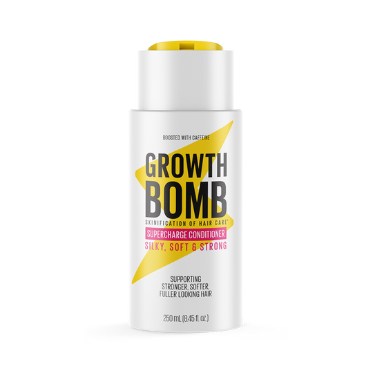 The 250 ML Supercharge Conditioner bottle showcases bold black and yellow text on a white label, highlighting benefits such as silky, soft & strong and promises to support fuller hair while protecting against breakage.
