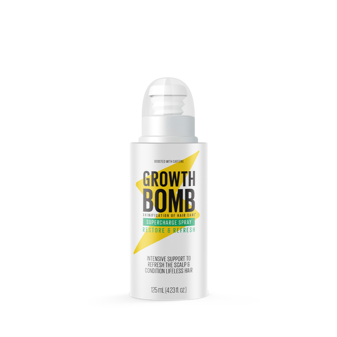 A white bottle of Supercharge Spray from Growth Bomb features a green and black label and offers intensive scalp support with peppermint oil, revitalizing lifeless hair. The leave-in spray reads Restore & Refresh, holding 125ml (4.23 fl oz).