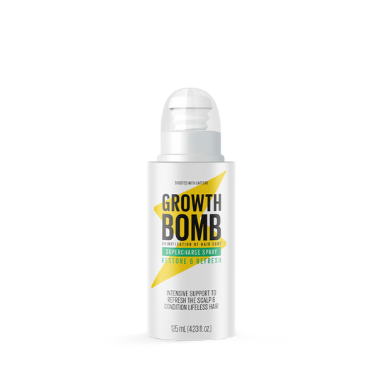 A white bottle of Supercharge Spray from Growth Bomb features a green and black label and offers intensive scalp support with peppermint oil, revitalizing lifeless hair. The leave-in spray reads Restore & Refresh, holding 125ml (4.23 fl oz).