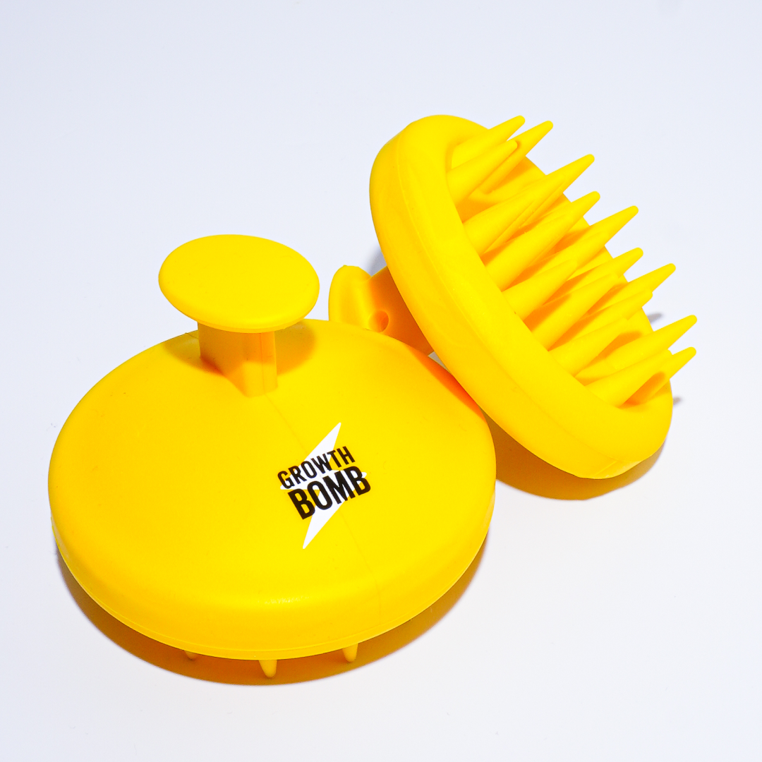 Growth Bombs bright yellow Silicone Scalp Brushes feature round handles and soft, flexible bristles, perfect for exfoliating and enhancing hair and scalp care, beautifully displayed on a white background.
