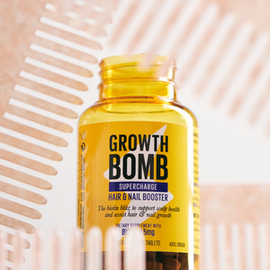 Hair and nail booster supplement bottle with yellow label and gold cap